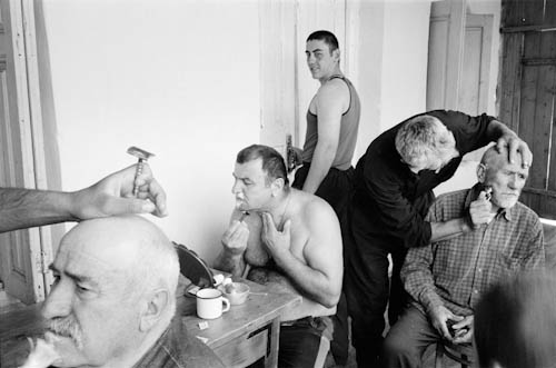 GEORGIA. Ushguli (Svanetia). 20/07/2000: Men shaving at “Ormotsi”, commemorating 40th day of mourning 100 yr old Mr Mosse Nigaradze.