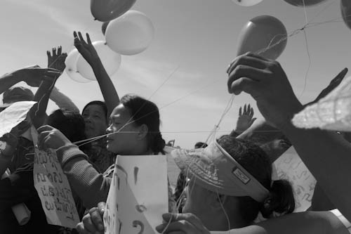 CAMBODIA. Phnom Penh. 1/12/2011: Boeung Kak lake residents presenting messages written with their own blood after press conference, some saying 'I defend my home and they treat me like a criminal'.