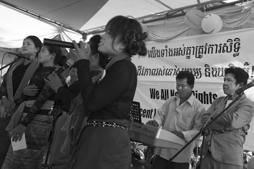 CAMBODIA. Phnom Penh. 10/12/2011: Boeung Kak lake community representatives singing songs about their plight during Human Rights Day celebrations.