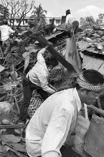 CAMBODIA. Phnom Penh. 3/01/2012: Residents collecting goods from their destroyed house during final eviction of the Borei Keila community.