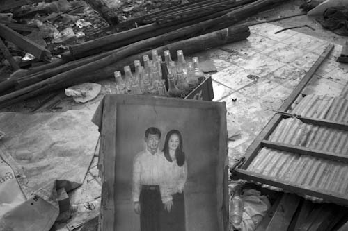CAMBODIA. Phnom Penh. 4/01/2012: Portrait of a couple amidst the rubble of destroyed houses on the day after the final eviction of the Borei Keila community.