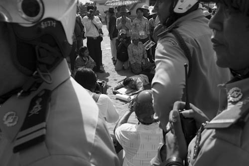 CAMBODIA. Phnom Penh. 22/05/2012: Evicted owner of a house at the Boeung Kak Lake community lying on the ground as a protest because he was prevented to rebuild a house on the sand of the filled-in lake.