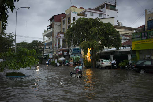 CAMBODIA. Phnom Penh. 8/05/2012: Flooded streets in Boeung Keng Kang area after first rains of the season.