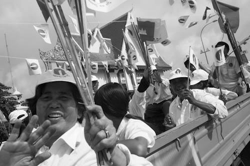 CAMBODIA. Phnom Penh. 18/05/2012: Sam Rainsy Party militants at first election campaign parade in front of the ruling CPP (Cambodian People's Party) headquarters on Norodom Blvd.