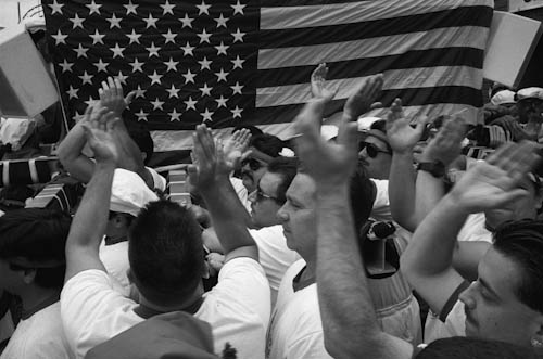 USA. Brooklyn (New York). 1995: Italian immigrant community celebrating religious festival with US banner.