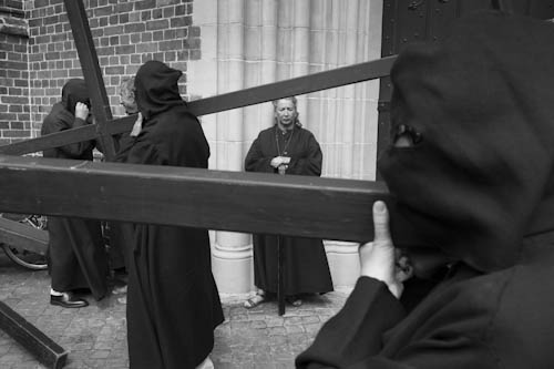 BELGIUM. Veurne (West Vlaanderen). 29/07/2012: Penitents carrying their cross at Procession.