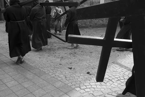 BELGIUM. Veurne (West Vlaanderen). 29/07/2012: Penitents carrying their cross at Penitent's Procession.