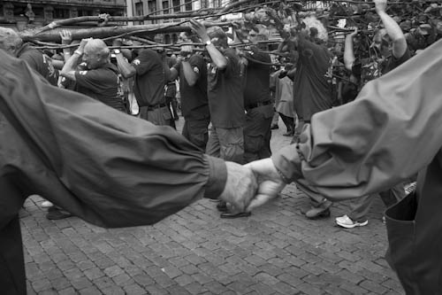 BELGIUM. Brussels. 9/08/2012: Participants to the Meyboom festival carrying the tree around  the Grand' Place.