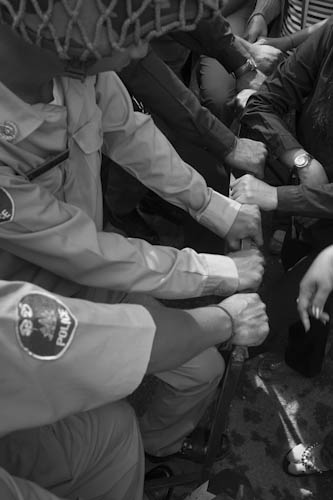 CAMBODIA. Phnom Penh. 2/10/2012: Boeung Kak Lake community representatives being prevented by a police road block to go to the Municipality to ask about progress regarding the outlining of the 12,44Ha for an on site development promised by Prime Minister Hun Sen.