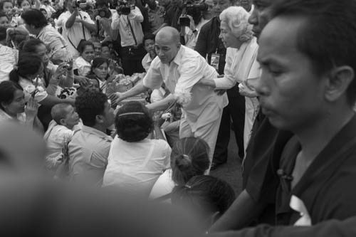 CAMBODIA. Phnom Penh. 23/10/2012: King Norodom Sihamoni and Queen Mother Monineath greeting the crowd praying in front of the Royal Palace on the 9th day after the death of King Norodom Sihanouk.