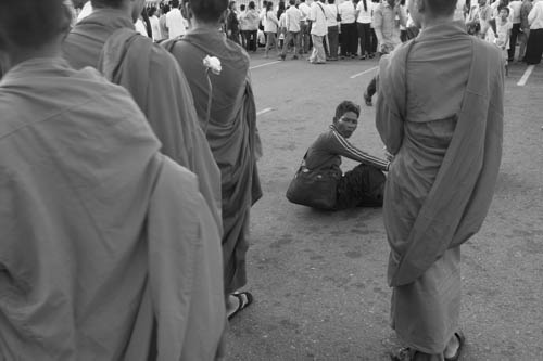 CAMBODIA. Phnom Penh. 28/10/2012: Beggar in front of the Royal palace on the 14th day of King Norodom Sihanouk's passing away.