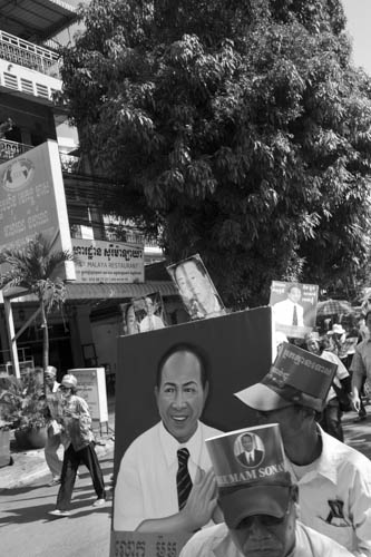 CAMBODIA. Phnom Penh. 14/12/2012: Supporters of Mam Sonando, Director of the Beehive Radio station accused of supporting a secessionist movement, after hearing his request for bail was rejected by the Cambodian Court, march through the streets towards the U.N. Human Rights office.