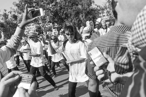 CAMBODIA. Phnom Penh. 17/12/2012: Human Rights activists dancing 'Gangnam style', when delivering a petition of over 40,000 signatures regarding Human Rights and land issues to the National Assembly.