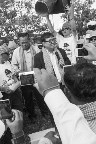 CAMBODIA. Phnom Penh. 17/12/2012: Ho Vann and Son Chhai, Sam Rainsy Party Parliamentarians at a Human Rights demonstration, 'Gangnam style', to deliver a petition of over 40,000 signatures regarding Human Rights and land issues to the National Assembly.