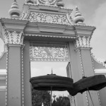 CAMBODIA. Phnom Penh. 01/02/2013: Umbrellas of King Norodom Sihamoni and Queen Mother Monineath entering the Royal Palace after having accompanied King Norodom Sihanouk's coffin to the cart bringing him to the cremation site.