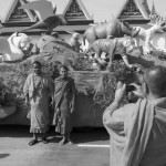 CAMBODIA. Phnom Penh. 2/02/2013: Souvenir photographs in front of the carts used in the procession to carry late King Norodom Sihanouk's coffin from the Royal Palace to the funeral pyre.