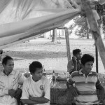 CAMBODIA. Kahchen (Ratanakkiri). 21/02/2013: Ethnic Tampuon villagers waiting to attend the monthly meeting related to community issues. Most of them are opposed to the construction of the Sesan3 dam and suspect the authorities of not listening to their concerns about depleting fish stocks, floodings, relocation sites and cultural identity.