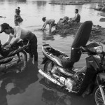 CAMBODIA. Sre Kor (Stung Treng). 27/02/2013: Evening bath in the Sesan river. The Sesan2 dam will be built downstream and the village will be flooded by the water from the reservoir.