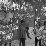 CAMBODIA. Sre Kor (Stung Treng). 28/02/2013: Members of this indigenous Tampuon minority demonstrate in the street of their village which will be flooded by the waters of the Sesan2 dam, forcing them to relocate in the near future.