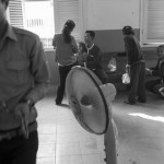 CAMBODIA. Phnom Penh. 6/03/2013: Sreng Phou and Ky Kea, who were sentenced together with Mam Sonando for participation to a so-called 'secessionist movement' are joined by their wife and children in the recess room during the Mam Sonando appeals trial.