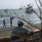 CAMBODIA. Kep. 7/04/2013: Local tourists near the crab sculpture.