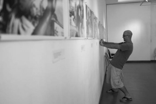 CAMBODIA, Phnom Penh. 29/05/2013: Thomas Cristofoletti, Photojournalist, helping to set up the 'Quest for Land' exhibition at Meta House.