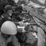CAMBODIA, Bati (Kompong Speu). 16/05/2013: Rescue workers look for victims in the rubble of part of an overloaded storage area which collapsed in the newly built Wing Star shoe manufacturing building. As of 11:00 AM, 2 workers were found dead. Some 8,000 workers are employed there.