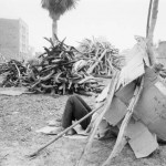 BURKINA FASO. Ouagadougou. 12/3/1985: Firewood salesman resting.