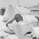 MALI. Mopti. 2/01/1986: Waiting to load bags of cotton.