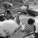 MEXICO. Maya Tecum. 25/06/1988: Guatemalan refugees receiving tin sheeting.