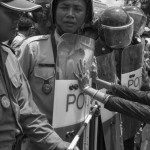 CAMBODIA. Phnom Penh. 2/07/2013: Members of the Boeung Kak Lake community, entagled in a land issue since 2007, try to push past a Police blockade preventing them from demonstrating in front of Prime Minister Hun Sen's house on Sihanouk Boulevard.