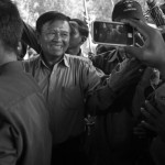 CAMBODIA. Vihear Suor (Kandal). 9/09/2013: Kem Sokha, Deputy President of the opposition CNRP, greeting supporters at a post election results rallye.