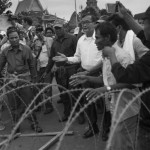 CAMBODIA. Phnom Penh. 15/09/2013: Sam Rainsy, CNRP President, at the site where a barbed wire barricade was torn down by CNRP supporters on the first day of a planned 3-day protest by the opposition CNRP to fight the results of the 2013 legislative elections which, according to the CNRP, were wrought with fraud and saw the ruling CPP lose a considerable number of seats to the CNRP while officially still maintaining a small majority.