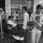 CAMBODIA. Phnom Penh. 22/09/2013: Voann Pov from the Informal Union, and another of the four representatives go through the paperwork with the police to deliver a petition the citizens want to King Norodom Sihamoni to receive regarding the 2013 legislative elections.