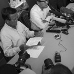 CAMBODIA. Phnom Penh. 25/09/2013: Kem Sokha and Sam Rainsy, co-Presidents of the opposition CNRP, holding a press conference at the party headquarters. Tioulong Saumura, MP and wife of Sam Rainsy behind them.