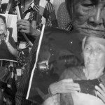 CAMBODIA. Phnom Penh. 14/10/2013: Members of the Boeung Kak lake community holding photographs of injured during protest in front of the Ministry of Interior about the vicious attack by masked thugs on a vigil they held on September 22nd, injuring several.