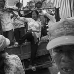 CAMBODIA. Phnom Penh. 6/10/2013: Supporters from the opposition CNRP disembark from trucks coming from the provinces to attend a 'public forum' at 'Freedom Place', two weeks after the CNRP boycotted the opening ceremony of the 2013 legislature.