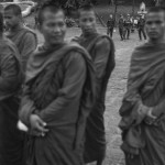 CAMBODIA. Phnom Penh. 18/10/2013: Municipal security guards keep a close eye on monks who want to join a small group of youth who attempt to have a prayer ceremony at Wat Phnom in memory of Mao Sok Chan who was fatally shot during the aftermath of September 15th opposition CNRP demonstration.