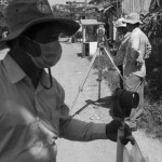 CAMBODIA. Phnom Penh. 6/11/2013: Surveyors from the Phnom Penh Municipality measuring the surface of 32 houses which were left out of the 12,44 Ha promised to the Boeung Kak lake community by Prime Minister Hun Sen back in August 2011 during the eviction of 4000 families by a real estate developer which acquired the lake as a concession and filled it with sand.