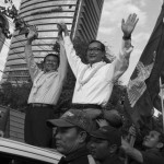 CAMBODIA. Phnom Penh. 20/12/2013: Sam Rainsy and Kem Sokha, co-Presidents of the CNRP, leading a motorcade on the 6th day of demonstrations by the opposition CNRP supporters to have Prime Minister Hun Sen step away from power after 28 years, following the 2013 Cambodian elections.