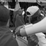 CAMBODIA. Phnom Penh. 20/12/2013: Monks participating at a motorcade on the 6th day of demonstrations by the opposition CNRP to have Prime Minister Hun Sen step away from power after 28 years, following the 2013 Cambodian elections.