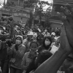 CAMBODIA. Phnom Penh. 24/12/2013: Workers on a strike try to convince workers in other factories to join them in demanding a salary increase of 80$ to reach 160$/ month instead of a 15$ increase just promised by the govenrment