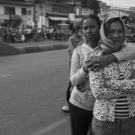 CAMBODIA. Phnom Penh. 24/12/2013: Workers on a strike try to convince workers in other factories to join them in demanding a salary increase of 80$ to reach 160$/ month instead of a 15$ increase just promised by the govenrment