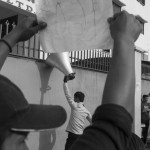 CAMBODIA. Phnom Penh. 24/12/2013: Workers on a strike try to convince workers in other factories to join them in demanding a salary increase of 80$ to reach 160$/ month instead of a 15$ increase just promised by the govenrment