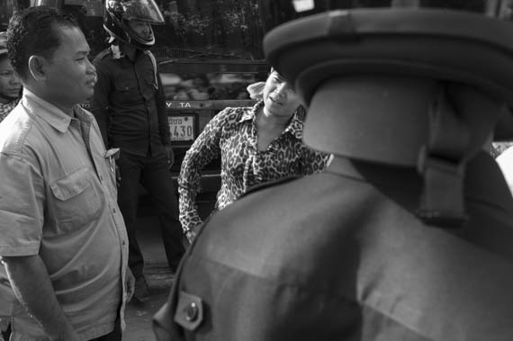 CAMBODIA. Phnom Penh. 6/01/2014: A still defiant Tep Vanny, land rigths activist, moments before she, Yorm Bopha, Bop Chorvy, Sok Serey Leap, and Pan Chunreth, land rights activists, were arrested on their way to demonstrate in front of the French Embassy to request the liberation of those arrrested during the heavy crackdown of the authorities following the workers demonstrations of the past weeks.