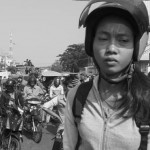 CAMBODIA. Phnom Penh.2/01/2014: Stuck in a trafic jam when garment factory workers block road Nr 2 at Chak Angre, following a dispute about wages. The workers demand 160$ per month but were promised 95$ and an additional 5$.