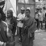 CAMBODIA. Phnom Penh.2/01/2014: Monks asking workers who are not striking to join garment factory workers blocking road Nr 2 at Chak Angre, following a dispute about wages. The workers demand 160$ per month but were promised 95$ and an additional 5$.