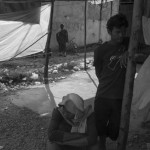 CAMBODIA. Phnom Penh.02/01/2014: Monk supporting the workers at The Yakjin factory who were dispersed in the morning by members of Unit 911 from the RCAF which is stationed nearby, causing 10 injured. Voan Pov, Union Leader, and three monks were beaten and arrested;