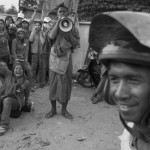 CAMBODIA. Phnom Penh.02/01/2014: Workers at The Yakjin factory who were dispersed in the morning by members of Unit 911 from the RCAF organise a roadblock on Road Nr 4. Voan Pov, Union Leader, and three monks were beaten and arrested earlier during the protest.