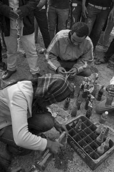 CAMBODIA. Phnom Penh.3/01/2014: Striking workers who pulled up barricades on Veng Sreng road are preparing Molotov cocktails before being brutally dispersed by armed forces, resulting in at least 3 dead, one badly injured and 3 confirmed arrests.